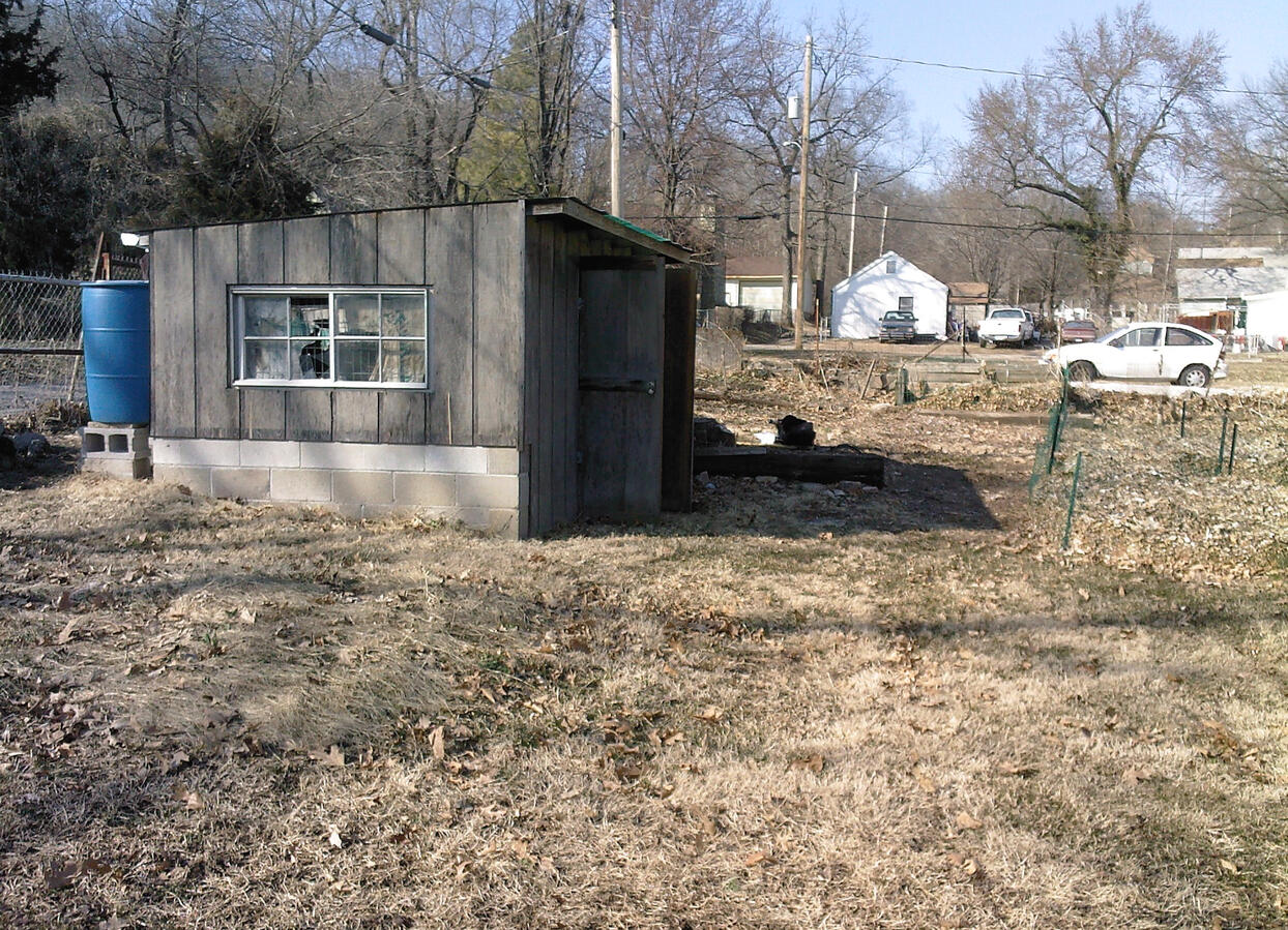 An old chicken coop served as our shed and rain runoff source.
