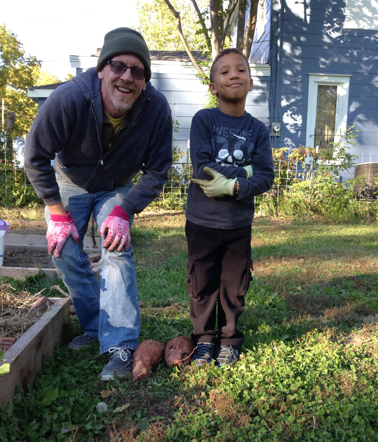 Grandson Alex helps me dig up tubers
